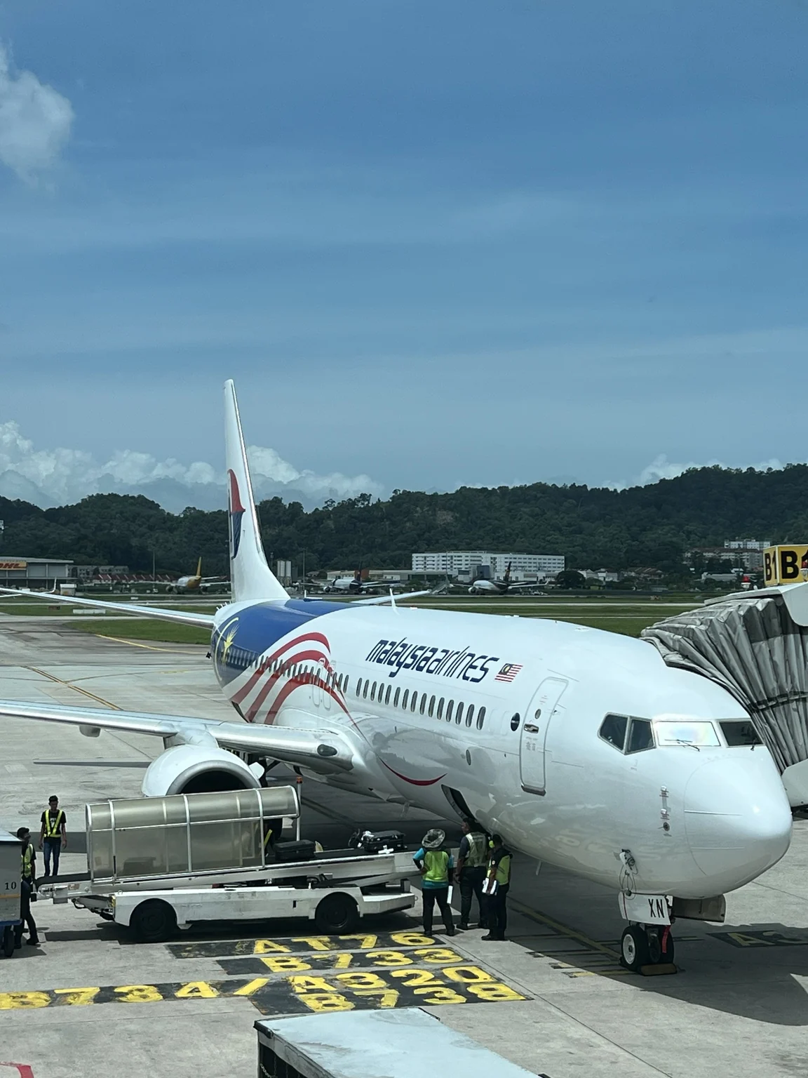A closer view of a Malaysia Airlines aircraft at the gate.